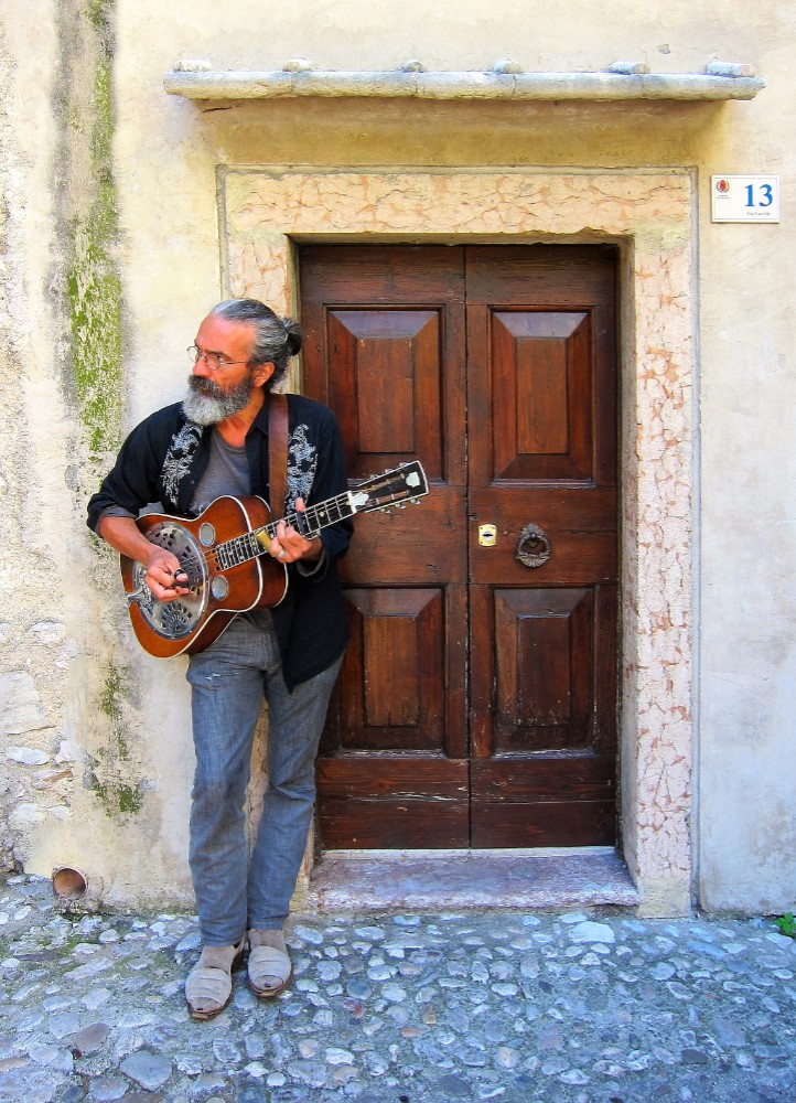 Italian Busker Lake Garda by Glynn May