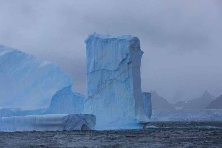 5578577 Sue Wright Calving And Breaking Apart Into Multiple Smaller Icebergs