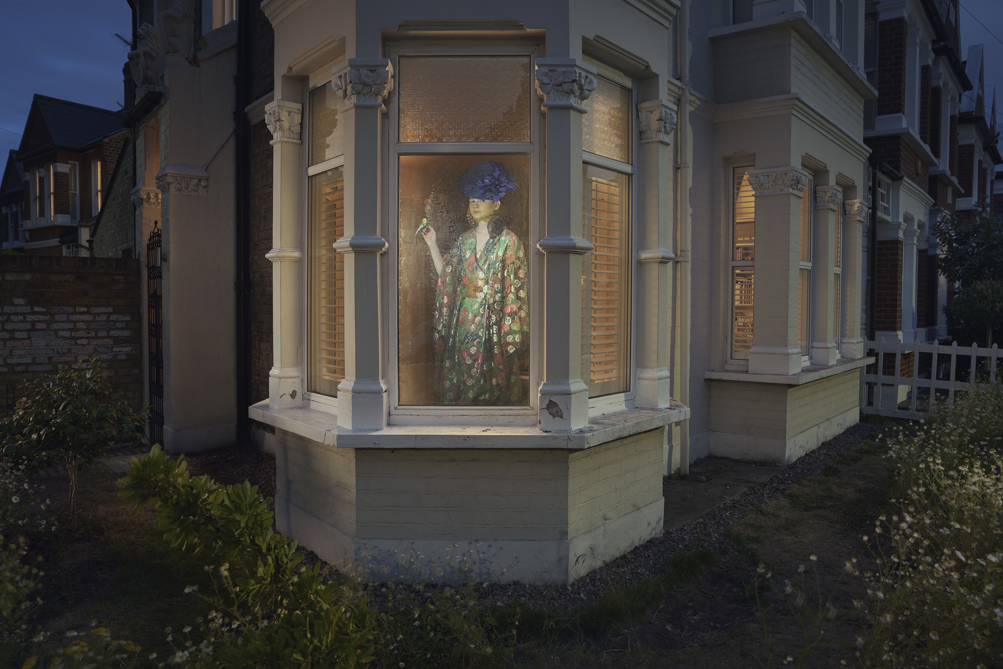 Alice stands at the window in a floral kimono