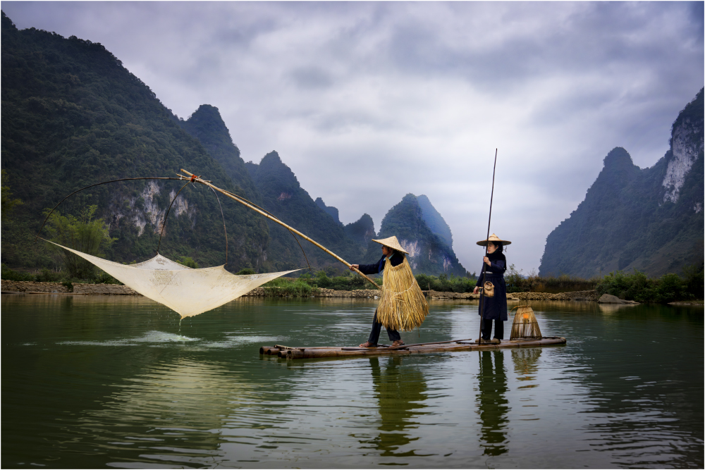 Early Morning On The Quay Son River Vietnam by Brian Houghton
