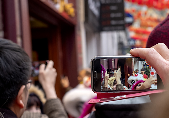 In The Crowd Watching A New Year Lion Dance