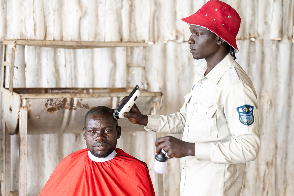Street Barbershop, Entebbe, Uganda by Thomas Andy Branson