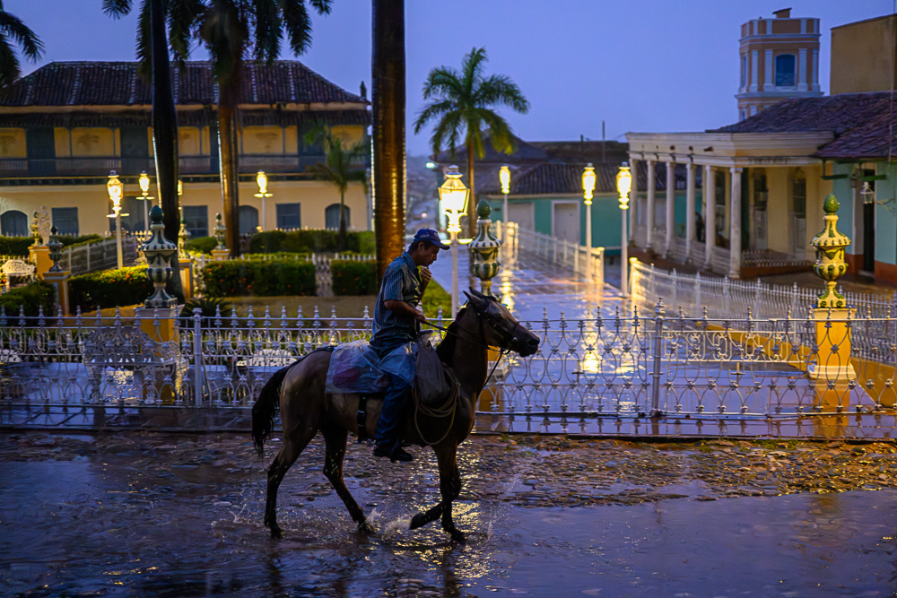 Cowboy In The Rain. Trinidad Cuba by Nicholas Harvey