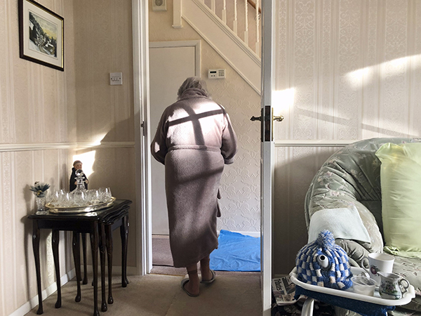 Elderly woman in doorway