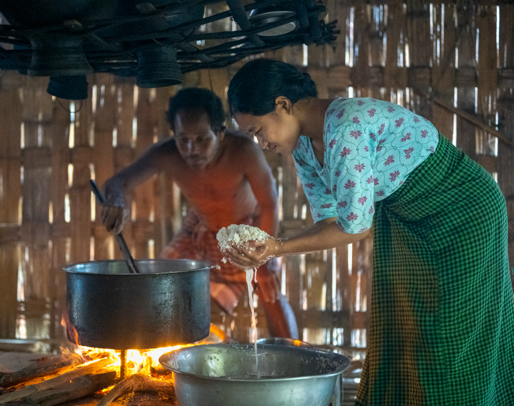COOKING RICE IN ASSAM INDIA 