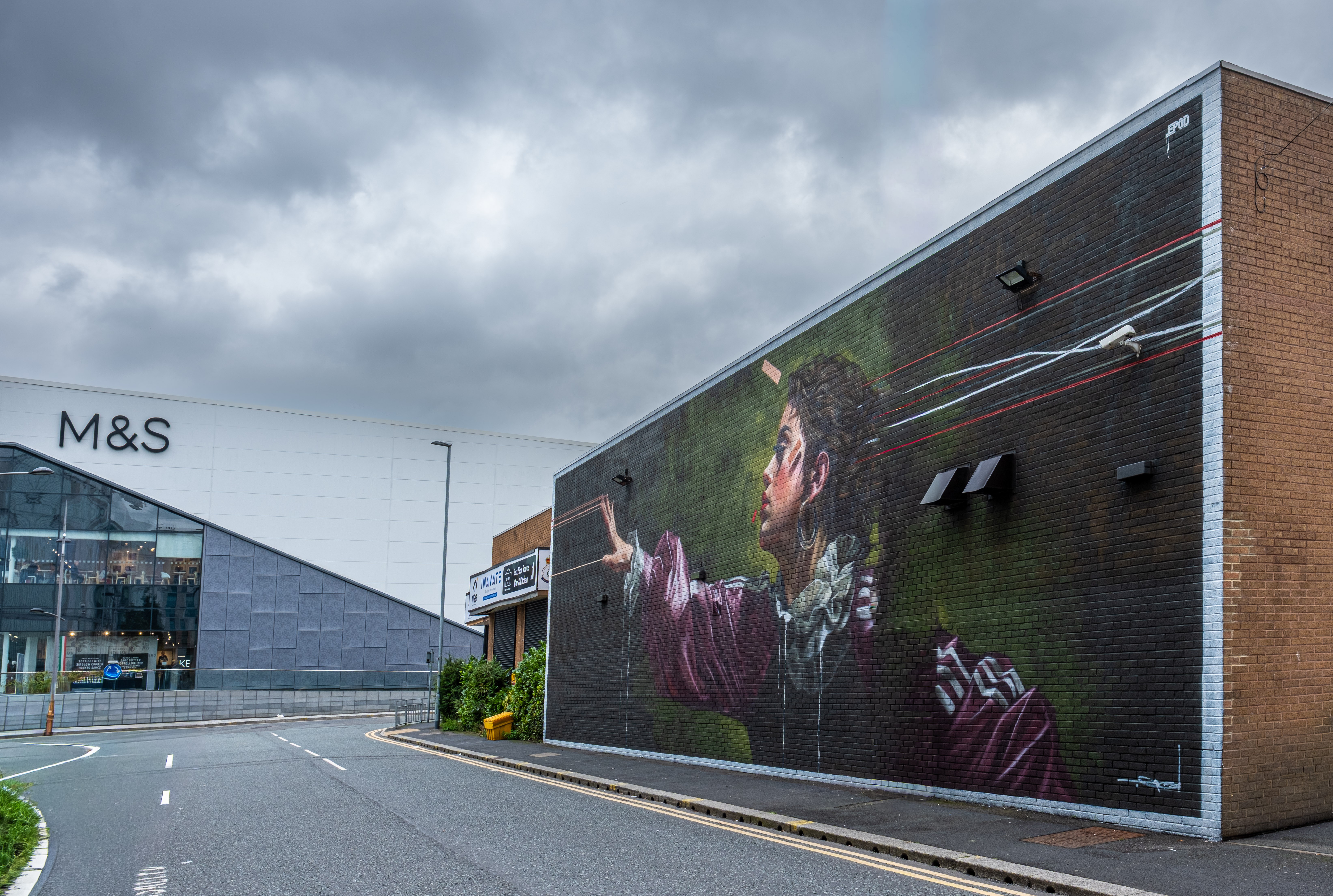 Mural on wall near shopping centre