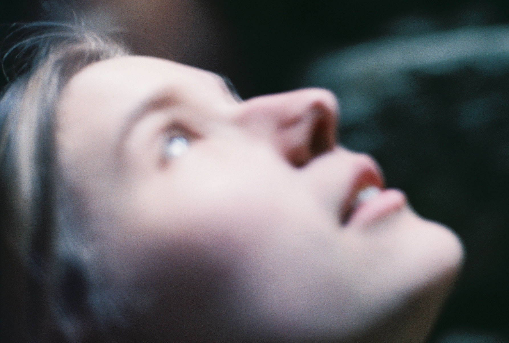 Portrait of woman looking to the sky, soft focus