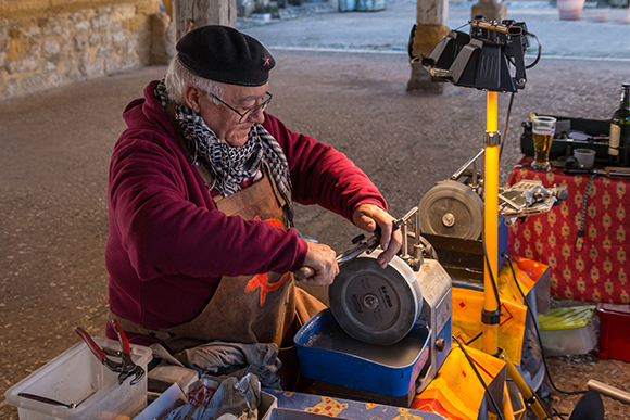 Knife Sharpener In Monpazier Market, France